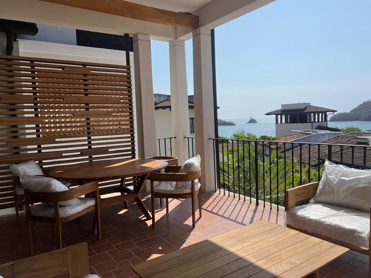 Balcony dining table with an ocean view