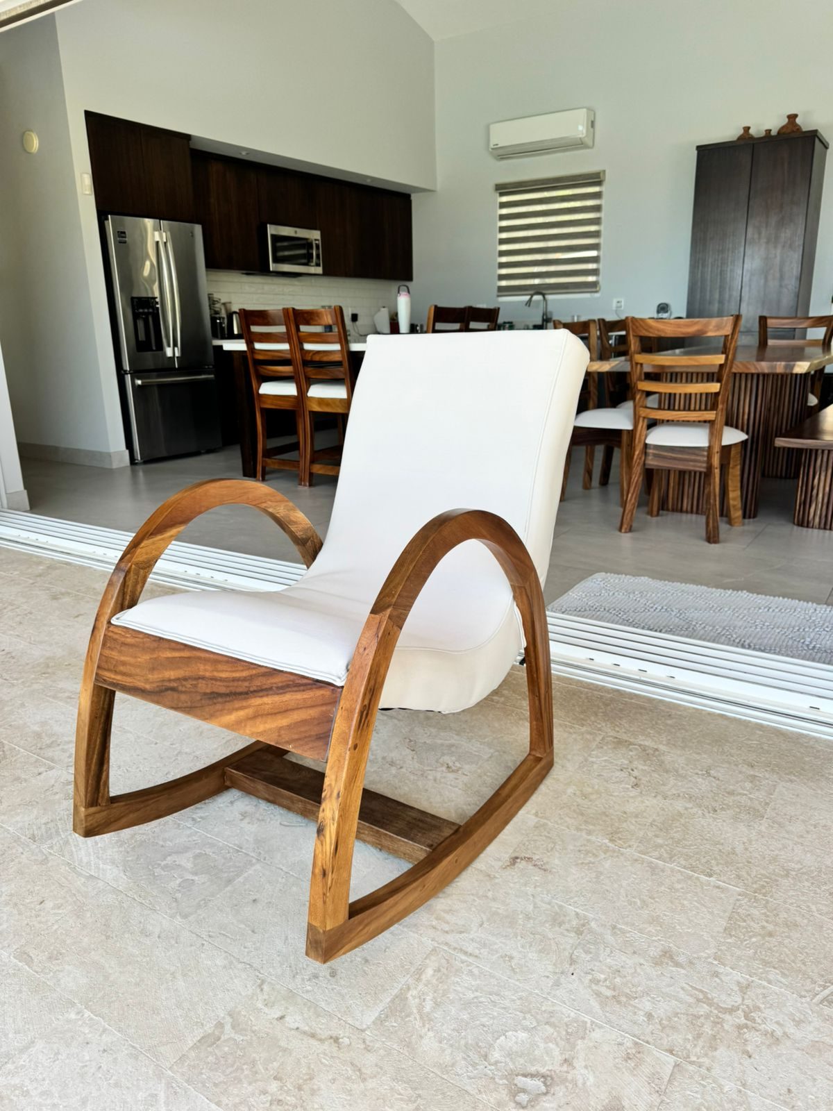 Wood and cream rocking chair on a terrace