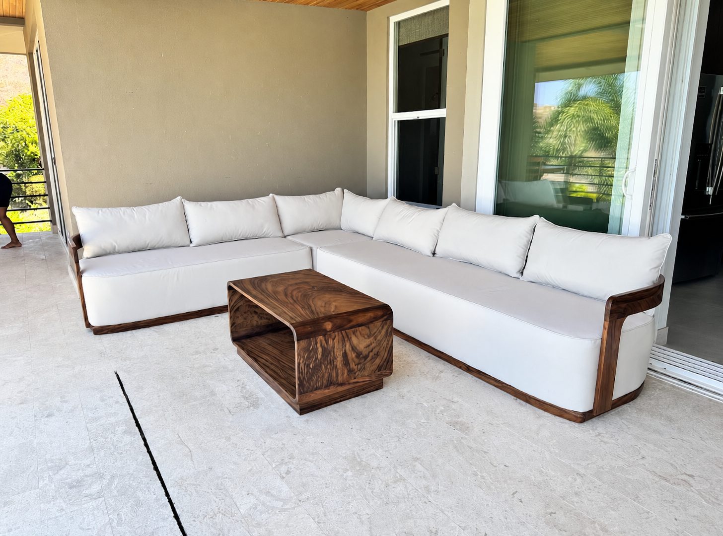 Outdoor sectional sofa with a wood coffee table