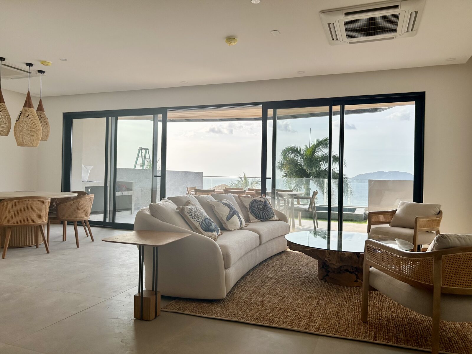 Living room opening to ocean views